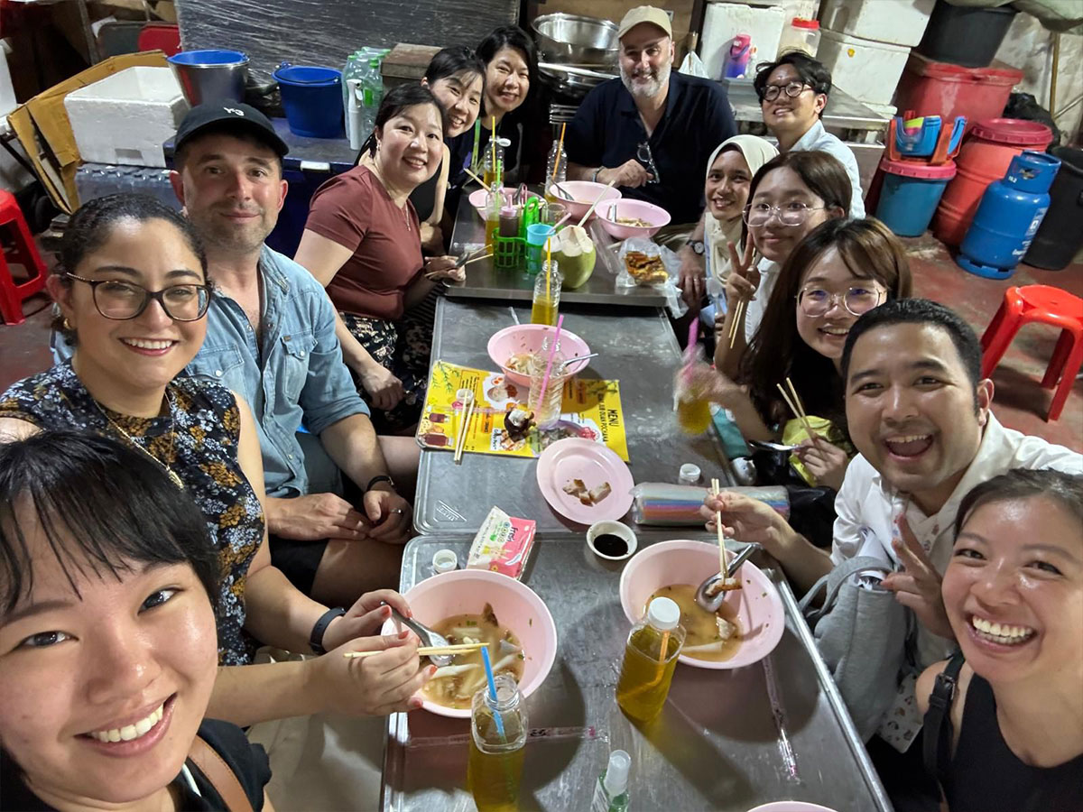 Researchers enjoy dinner together in Bangkok.